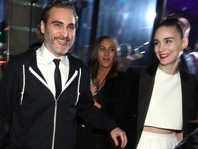 Joaquin Phoenix (L) and Rooney Mara attend Michael Muller's "Heaven," presented by The Art of Elysium, on Jan. 5, 2019 in Los Angeles.