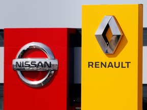 The logos of car manufacturers Renault and Nissan are seen in front of dealerships of the companies in Reims, France, July 9, 2019.