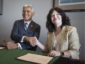 "Options are important." Patti France, president of St. Clair College, and M. Roy Wilson, president of Wayne State University, signed an agreement on July 10, 2019, at the St. Clair College Centre for the Arts that gives local postsecondary students more cross-border educational choices.