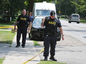 Tecumseh OPP investigators examine where a man was found with significant injuries on the morning of July 26, 2019.