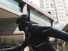 The statue in front of the headquarters of the Toronto Police Service is shown in this July 2019 file photo.