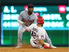 Niko Goodrum of the Detroit Tigers tags out Rougned Odor of the Texas Rangers stealing second base in the eighth inning at Globe Life Park in Arlington on August 3, 2019 in Arlington, Texas.