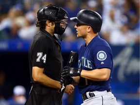 Kyle Seager #15 of the Seattle Mariners has words for the umpire after striking out in the ninth inning during a MLB game against the Toronto Blue Jays at Rogers Centre on Aug. 16, 2019, in Toronto.