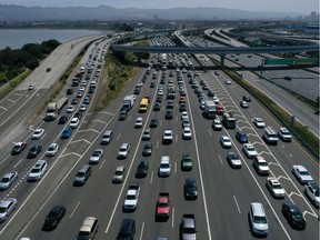 Traffic backs up at the San Francisco-Oakland Bay Bridge toll plaza along Interstate 80 on July 25, 2019 in Oakland, California. The State of California and four of the largest automakers in the world - Ford, VW, Honda and BMW - have struck a deal to reduce auto emissions in the State of California ahead of the Trump administration's plans to eliminate an Obama-era regulation to reduce emissions from cars that are believed to contribute to global warming.