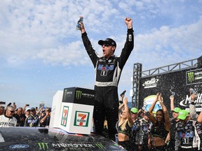 Kevin Harvick, driver of the Mobil 1 Ford, celebrates in Victory Lane after winning the Monster Energy NASCAR Cup Series Consumers Energy 400 at Michigan International Speedway on August 11, 2019 in Brooklyn, Michigan.