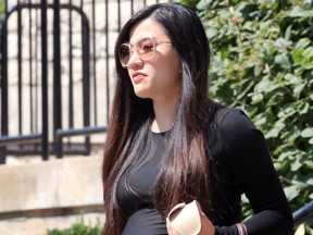 Zi Xi Wang leaves Mackenzie Hall during a landlord/tenant tribunal hearing in August 2019.