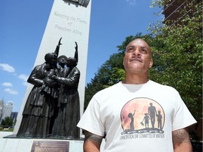 Bradley Jones discusses Emancipation Day celebrations Friday at Tower of Freedom Monument Friday.