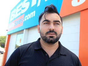 Windsor, Ontario. August 14, 2019 -- Simon Laski of Best Rate Auto is being considered a hero after jumping out of his car and into a pond on McHugh Street to save an unconscious crash victim from drowning.