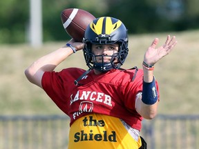 Windsor, Ontario. August 15, 2019 -- Lancers quarterback Sam Girard tosses during drills at Alumni Field.