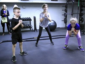 Brysen Brady, 8, left, Abbey Labine, 13, and Emmerson Wakonich, 11, workout at The Barry and Stephanie Zekelman Kids First Fitness Centre at 900 Howard Ave. Thursday.  The fitness facility for at-risk youth will be a new program for Windsor Family Homes and Community Partnerships.