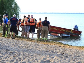 A LaSalle Fire and Rescue boat goes in the water at Lakewood Park in Tecumseh to assist with a search for a missing boater on Lake St. Clair on Saturday.