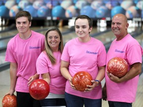Justin Jewell, centre right, poses with his family at Rose Bowl Lanes during the Katelyn Bedard Bone Marrow Association's 14th Annual "Bowling for Bone Marrow" Saturday.  Joining Justin were his brother Alex, left, and mom and dad, Lorraine and Jim Jewell, and hundreds of other participants and supporters.