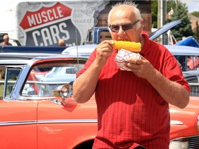 In this file photo from the 2019 Tecumseh Corn Festival, Keith Quick of Leamington enjoys a cob of corn while visiting the festival's Cream of the Crop car show.