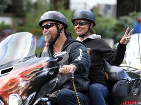 A pair of unidentified riders make their first turn during Sunday's On a Mission for the Downtown Mission Motorcycle Ride. Hundreds left the Downtown Mission on their way to Colchester.