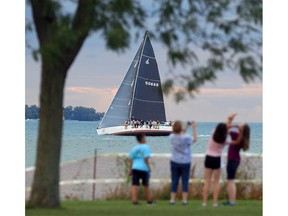 A sailing vessel passes in front of Sand Point Beach and Stop 26 after completing the Windsor Yacht Club's Wednesday night club race on Lake St. Clair.  With our higher water levels in recent months,  boats of any size are offering a different, higher perspective in the water.