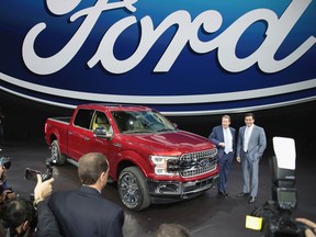 Bill Ford (L), Executive Chairman of Ford and Mark Fields, President and CEO, show off Ford's new F150 at the North American International Auto Show on January 9, 2017 in Detroit, Michigan. The show is open to the public from January 14-22.