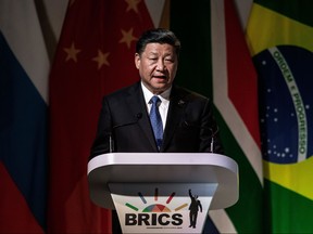 China's President Xi Jinping addresses delegates at a Business Forum organised during the 10th BRICS (acronym for the grouping of the world's leading emerging economies, namely Brazil, Russia, India, China and South Africa) summit on July 25, 2018 at the Sandton Convention Centre in Johannesburg, South Africa. (Gianluigi Guercia/Getty Images)