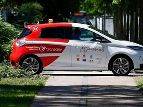 An autonomous car drives past during a press presentation in the north-western French city of Sotteville-lès-Rouen, near Rouen.
