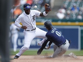 Detroit, MI, USA; Detroit Tigers shortstop Niko Goodrum is unable to make an out at second base against Seattle Mariners right fielder Mallex Smith during the seventh inning at Comerica Park.