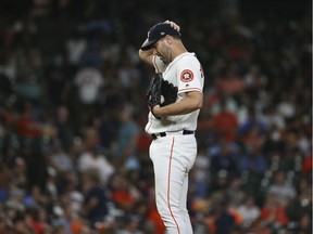 Houston Astros starting pitcher Justin Verlander reacts after giving up a home run against the Detroit Tigers during the ninth inning at Minute Maid Park.