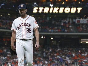 Houston Astros starting pitcher Justin Verlander walks off the mound after recording a strikeout against the Detroit Tigers during the ninth inning at Minute Maid Park.