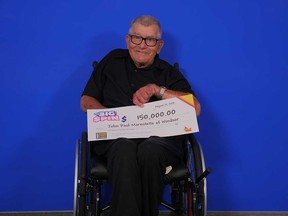 John Paul Marentette, 78, of Windsor, with the $150,000 prize cheque he won from playing The Big Spin.