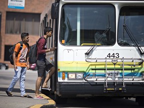 Riders board a Transit Windsor bus in downtown Windsor, Wednesday, August 21, 2019.