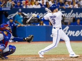 Brandon Drury of the Toronto Blue Jays hits a grand slam against the Texas Rangers in the fourth inning during their MLB game at Rogers Centre on Aug. 12, 2019 in Toronto.