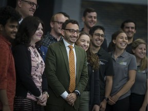 Mississauga MP Omar Alghabra, Parliamentary Secretary to the Minister of International Trade Diversification, centre, St. Clair College president, Patti France, and Windsor mayor, Drew Dilkens, are joined by students for a photo following an announcement by Alghabra about funding for students to study abroad,  on Thursday, August 22, 2019 at St. Clair College.