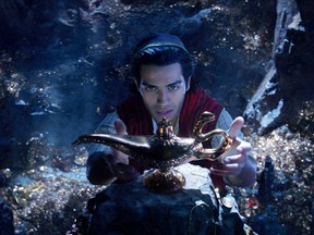 This image released by Disney shows Mena Massoud as Aladdin in Disney's live-action adaptation of the 1992 animated classic "Aladdin." (Disney via AP)