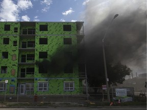 Fire crews battled black smoke at 850 Wyandotte St. W., a residential development to be known as West Bridge Place, on Thursday, Aug. 22, 2019.