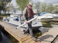 Students and researchers from the Great Lakes Institute for Environmental Research participated in a binational effort to get water samples from the western end of Lake Erie on Wednesday, August 7, 2019. Ken Drouillard a professor with the University of Windsor steps off the GLIER's boat at the Island View Marina in LaSalle.