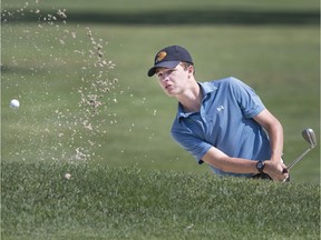 Paul Schiller, 16, from Kingsville, chips out of the sand onto the 17th green during the Essex-Kent Junior Golf Tournament at Roseland Golf and Curling Club, Monday, August 19, 2019.