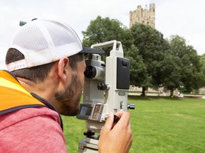 Dellon Meyers, a Western University civil engineering student from Haliburton, takes measurements as part of a two-week surveying course on campus in London, Ont.