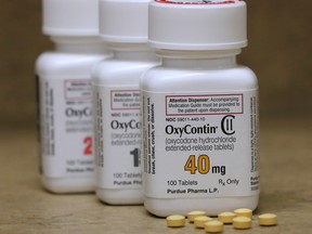 Bottles of prescription painkiller OxyContin pills, made by Purdue Pharma sit on a counter at a local pharmacy in Provo, Utah, U.S., April 25, 2017. (REUTERS/George Frey)