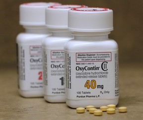 Bottles of prescription painkiller OxyContin pills, made by Purdue Pharma sit on a counter at a local pharmacy in Provo, Utah, U.S., April 25, 2017. (REUTERS/George Frey)