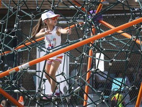 Deanna Tran, 6, plays on some of the climbing equipment at the Farrow Riverside Miracle Park during a media preview of the Riverside facility on Wednesday, August 7, 2019.