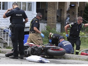 A motorcyclist sustained significant but non-life threatening injuries after crashing his bike on Mill St. near Wyandotte on Wednesday, August 14, 2019 in Windsor. Emergency personnel are shown tending to the man. The accident occurred at approximately 1 p.m.
