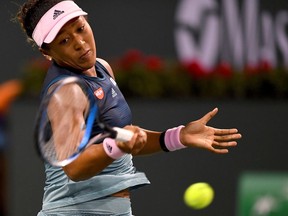 Last year's US Open women's champion Naomi Osaka (JPN) during her fourth round match against Belinda Bencic in the BNP Paribas Open at the Indian Wells Tennis Garden.