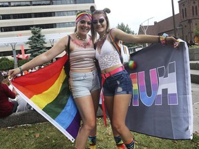 The Windsor-Essex Pride Fest held a flag raising ceremony Wednesday, August 7, 2019, at the Charles Clark Square to kick off the event. Gracelynn Wood, left, and Mallory Johnston, both 17, are shown during the event.