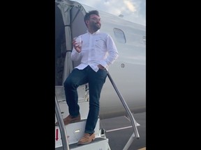 The screenshot from a video posted on Twitter shows passenger Vincent Peone, who was the only passenger on his flight after it was rescheduled.