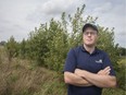 Rob Davies, a forester with the Essex Region Conservation Authority, stands next to a reforestation project for the Town of Essex, located next to the Essex sewage lagoons, Tuesday, August 20, 2019.  Reforestation projects like these are under threat from funding cuts from the provincial government.