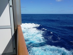 Monster waves began to calm after the Carnival Sunrise turned back toward New York in this balcony photo. (Jim Fox)