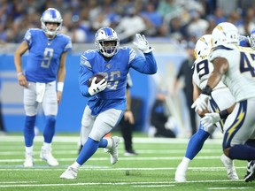 DETROIT, MI - SEPTEMBER 15: C.J. Anderson #26 of the Detroit Lions runs for a first down during the fourth quarter of the game against the Los Angeles Chargers at Ford Field on September 15, 2019 in Detroit, Michigan.