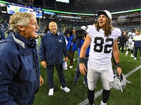 Head coach Pete Carroll of the Seattle Seahawks and Luke Willson of the Oakland Raiders catch up after the pre-season game at CenturyLink Field on Aug. 29, 2019, in Seattle, Wash.