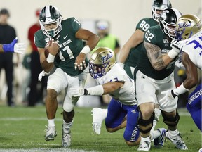 Connor Heyward of the Michigan State Spartans runs with the ball against the Tulsa Golden Hurricane in the third quarter at Spartan Stadium on August 30, 2019 in East Lansing, Michigan.
