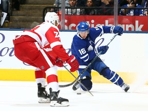 Mitch Marner #16 of the Toronto Maple Leafs battles for the puck with Madison Bowey #74 of the Detroit Red Wings during an NHL pre-season game at Scotiabank Arena on Saturday night. (Photo by Vaughn Ridley/Getty Images)