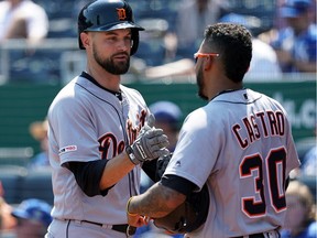Jordy Mercer #7 of the Detroit Tigers is congratulated by Harold Castro #30 after hitting a home run during the 4th inning of the game against the Kansas City Royals at Kauffman Stadium on Sept. 5, 2019, in Kansas City, Missouri.