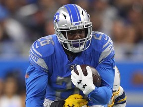 C.J. Anderson #26 of the Detroit Lions runs for a first down in the fourth quarter while playing the Los Angeles Chargers at Ford Field on September 15, 2019 in Detroit, Michigan. Detroit won the game