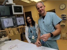 Dr. Sophia Thomas and Dr. Jack Speirs hold up a stint that is used in patients suffering from a stroke at Windsor Regional Hospital Ouellette Campus in Windsor on Dec. 22, 2014.